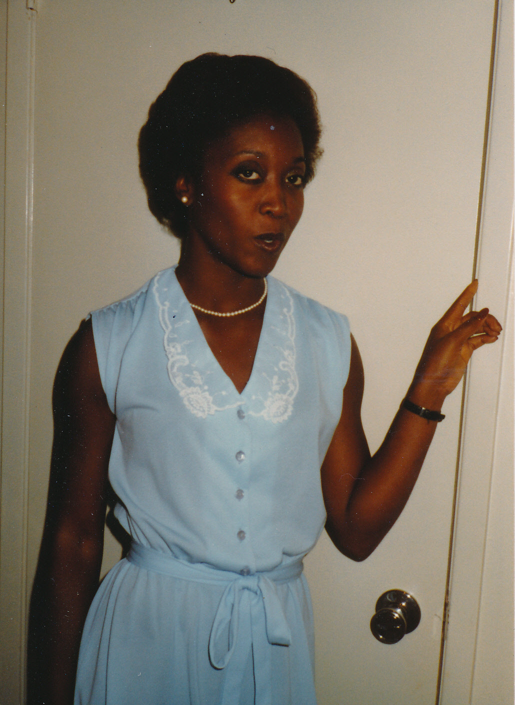 Arlinda standing in a doorway